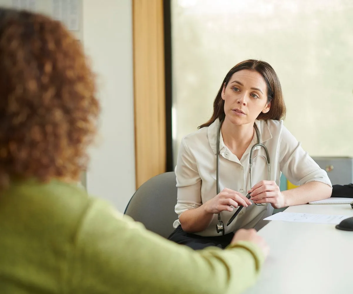 Woman speaking to female doctor about menopause