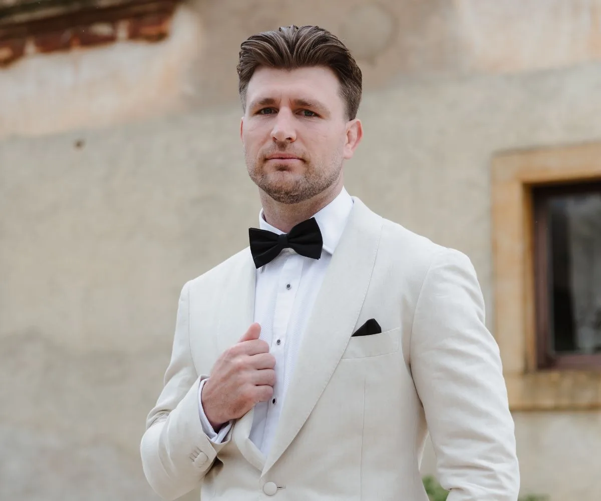 Jai Arrow in a white suit on his wedding day
