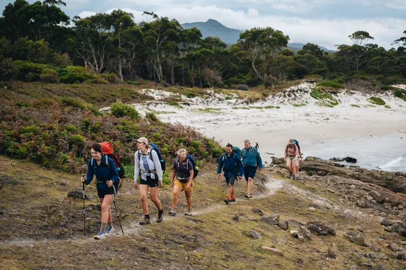 Hikers walking along the stunning Maria Island.