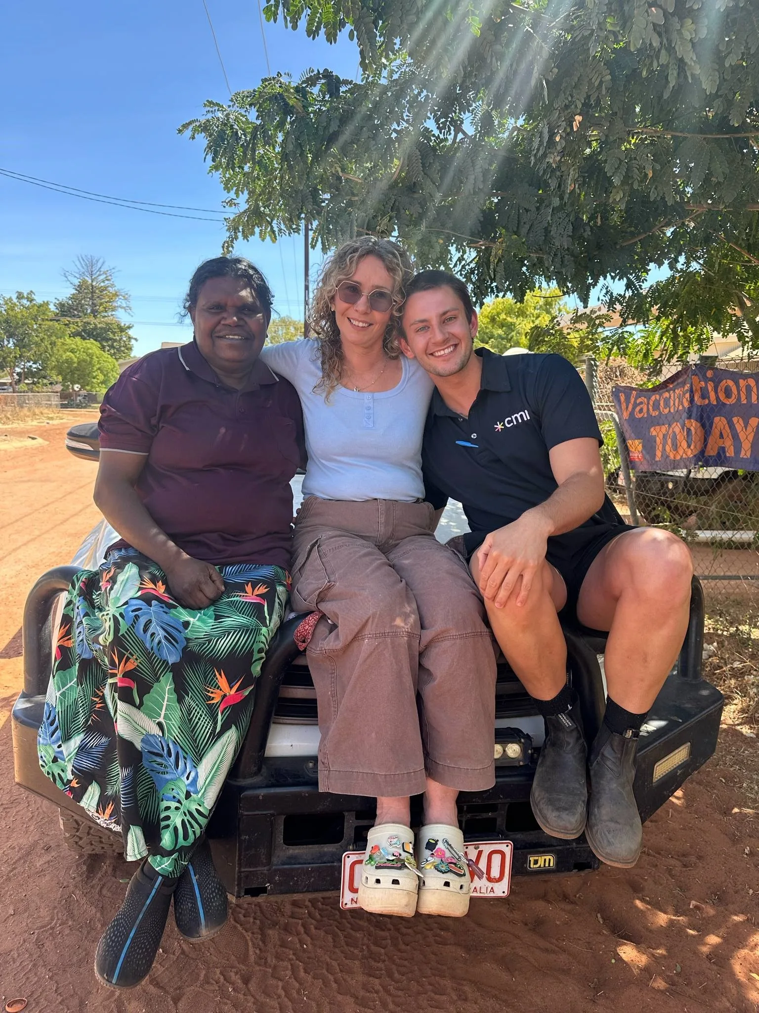 Hamish, with Halls Creek nurses, loves the red dirt and the communities he works with in his role as an outback nurse
