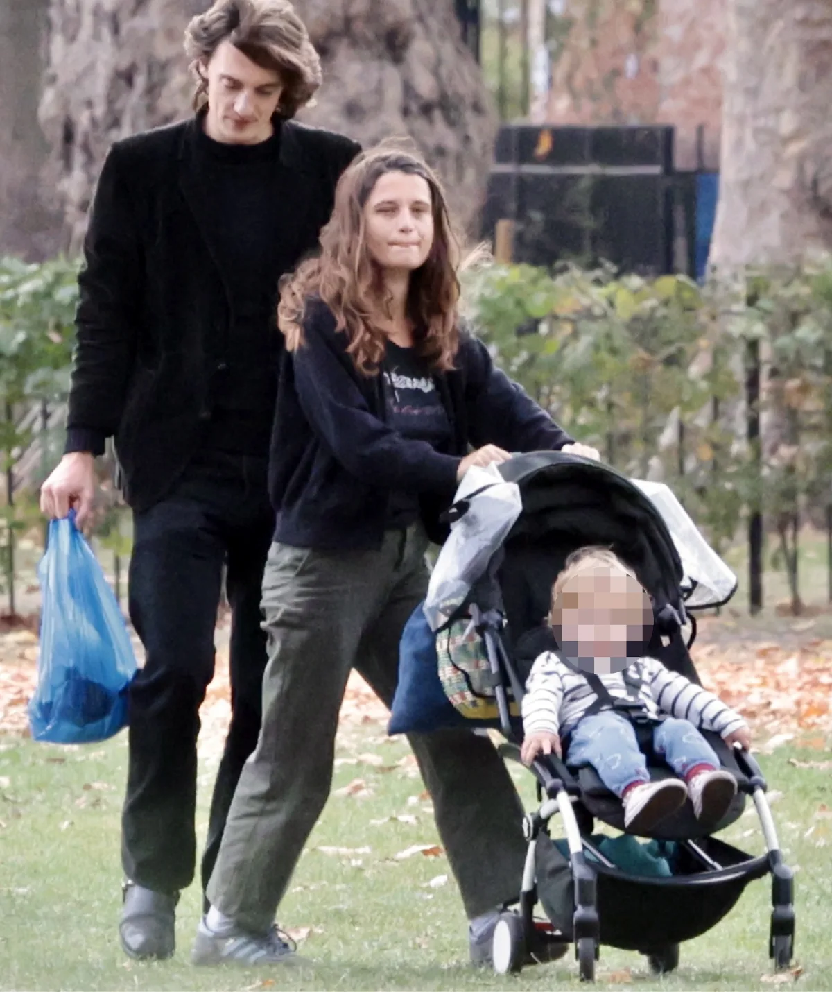 Tigerlily Hutchence in park with son and partner 