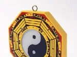 Yin Yang symbol on a decorative octagonal frame with Chinese trigrams, used in Feng Shui.