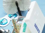 Various menopause supplements and a pill organizer on a blue background.