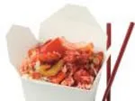Chinese takeout box with stir-fried vegetables and rice, paired with red chopsticks.