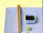 Plate with chopsticks, a small dish of soy sauce, and wasabi.