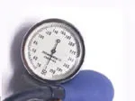 Blood pressure gauge with blue bulb on a white background.