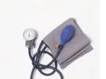 A blood pressure cuff with a blue bulb and gauge on a gray fabric background.