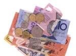 Australian currency including colorful banknotes and coins arranged in a pile.
