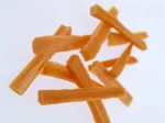 Dried papaya strips on a white background.