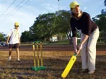 Deb Thomas practises her cricket swing in Darwin