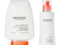 Pevonia Botanica Ligne Tropicale skincare set with two white bottles, orange accents, and black text.