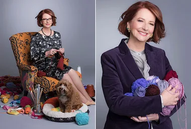 A woman knitting with wool and a small dog beside her, and holding yarn bundles, smiling at the camera.