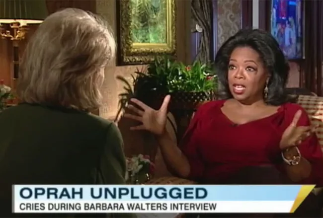 Oprah Winfrey gestures animatedly during an interview with Barbara Walters, with a headline "Oprah Unplugged."