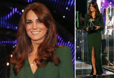 Royal in elegant green dress, smiling, holds award.