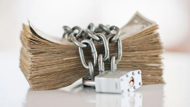 cash in padlock, Getty Images