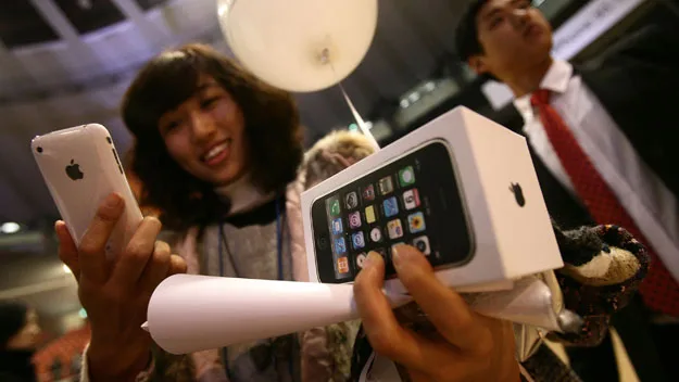 Asian woman with iphone Getty Images