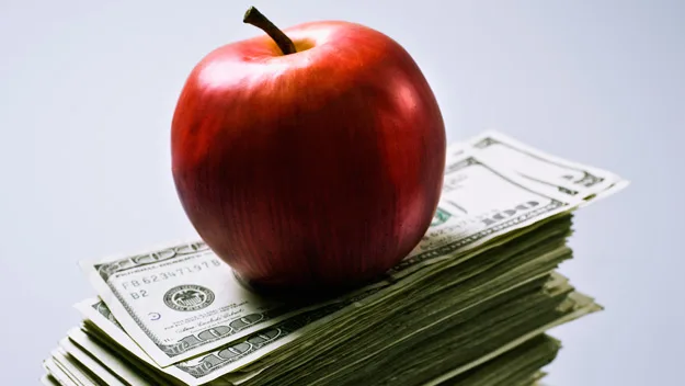 apple and money, getty images