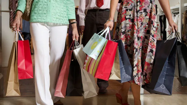 women with shoppings bags, Getty Images