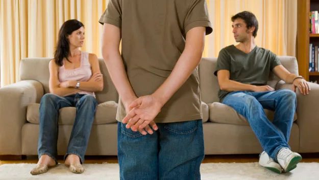 parents on lounge, with child, Getty Images