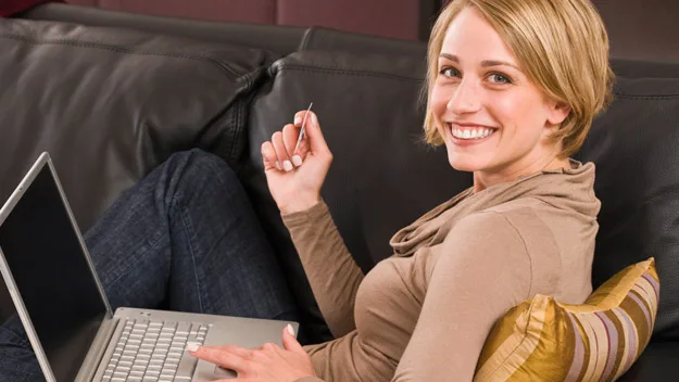 women with laptop on lounge, thinkstock