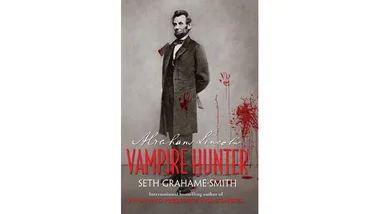 Abraham Lincoln stands in a blood-splattered coat, holding an axe, on the cover of "Abraham Lincoln: Vampire Hunter."