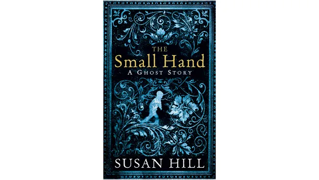 Cover of "The Small Hand: A Ghost Story" by Susan Hill, featuring intricate blue designs and a small child silhouette.
