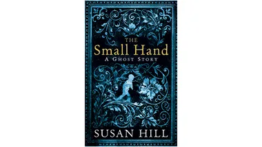 Cover of "The Small Hand: A Ghost Story" by Susan Hill, featuring intricate blue designs and a small child silhouette.