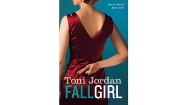 Book cover of "Fall Girl" by Toni Jordan, showing a woman in a red dress with fingers crossed behind her back.
