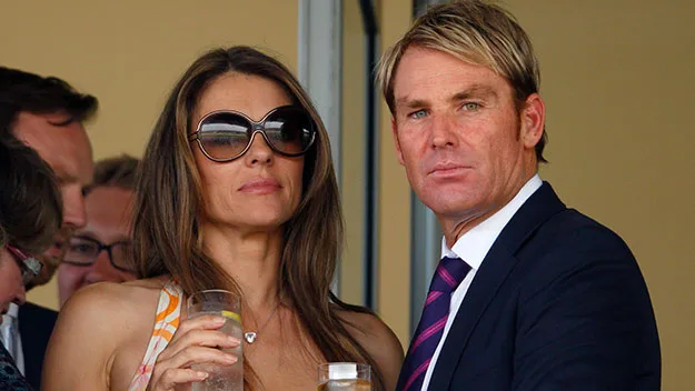 Shane Warne and Liz Hurley in July.