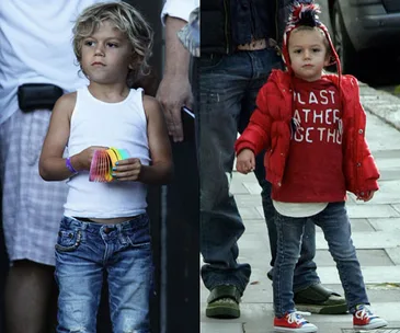 Younger children in trendy outfits; one in a tank top and jeans, the other in a red jacket and jeans.