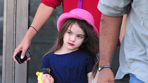 Suri Cruise wearing her lipstick