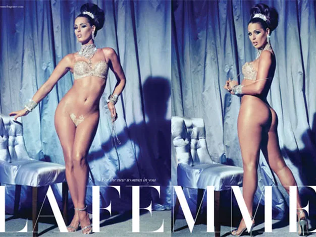 Alt text: "Woman in lingerie pose for LA FEMME magazine cover, elegant setting with silk drapes and chairs."
