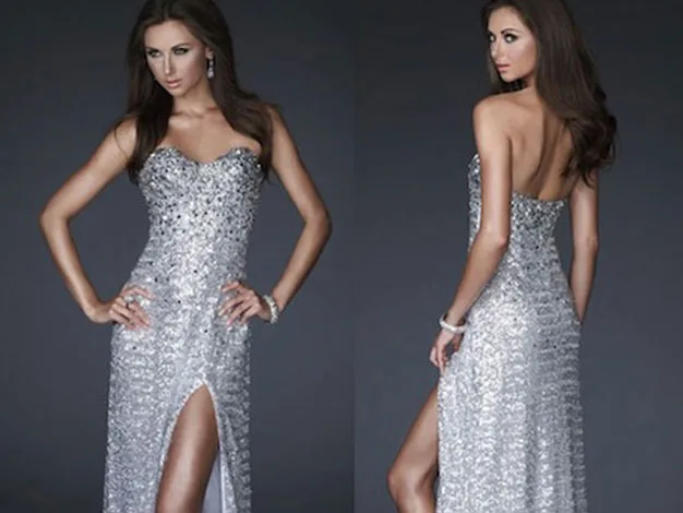 Elegant woman in a sparkling silver strapless gown with a thigh-high slit, posing from front and back.