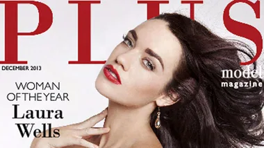 Laura Wells on magazine cover titled "Woman of the Year", wearing red lipstick and earrings, with "PLUS Model" text.