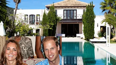 Royal couple smiling in front of luxurious Ibiza villa with a pool.