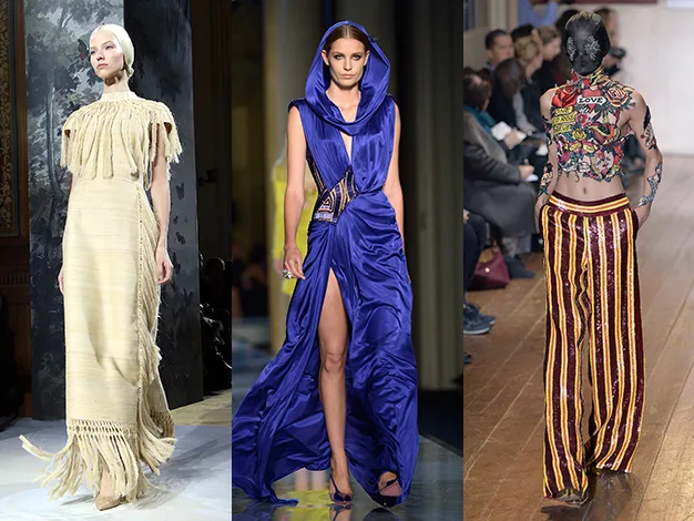 Models in runway fashion: beige fringed dress, blue hooded gown, striped pants with tattooed back.