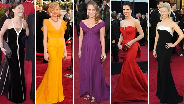 Women in colorful gowns on the Oscars red carpet, showcasing elegant fashion styles.