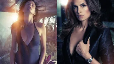 Cindy Crawford in a black swimsuit and blazer, posing outdoors, showcasing elegance and confidence.