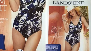 Model in Lands' End swimwear with a tropical print, posing with hand on hip wearing a straw hat.