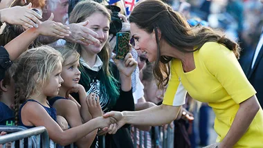 Kate Middleton greeting children in Sydney yesterday.