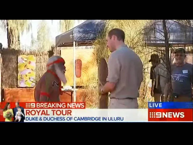 "Image shows a man talking to an Indigenous elder in Uluru during the Duke and Duchess of Cambridge's royal tour."