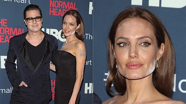 A woman poses on the red carpet, makeup is uneven highlighting her jawline starkly against her skin tone.