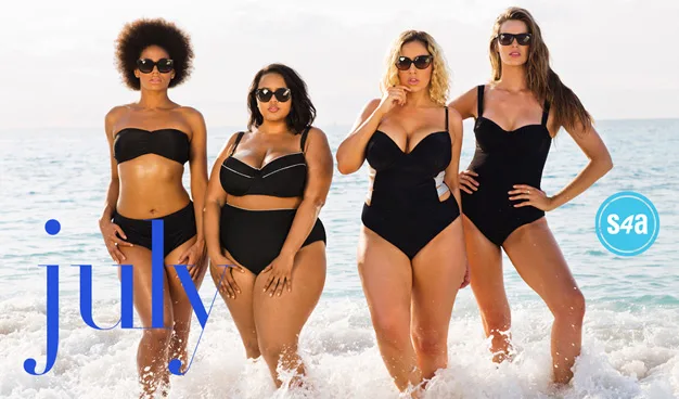 Four women in black swimsuits standing in ocean waves, with the word "July" and "S4A" logo visible.