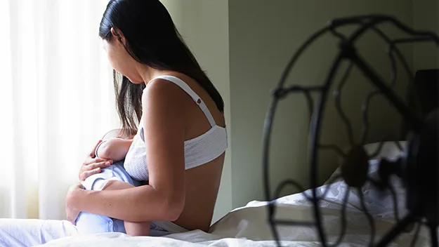 Mother breastfeeding baby