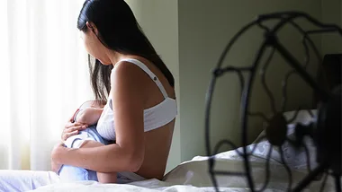 Mother breastfeeding baby