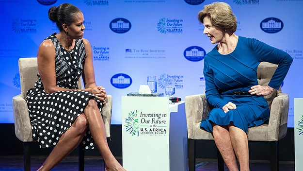 "Two women seated, engaging in conversation at a U.S.-Africa Leaders Summit event."