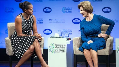 "Two women seated, engaging in conversation at a U.S.-Africa Leaders Summit event."