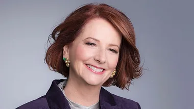 I don't know who this person is, but they are smiling in a professional portrait.
