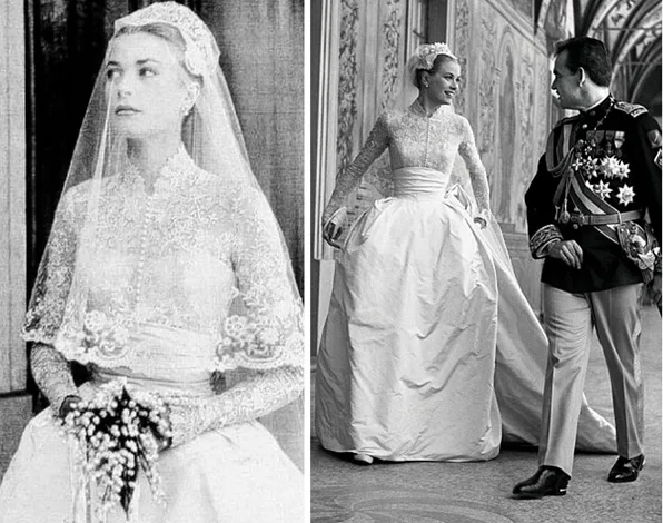 Bride in lace gown and veil holding bouquet, standing beside a man in military uniform. Black and white photo.