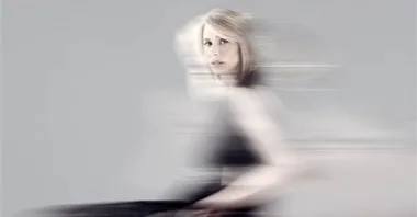 A woman in a wheelchair, with a blurred motion effect, symbolizing empowerment and dynamic strength.